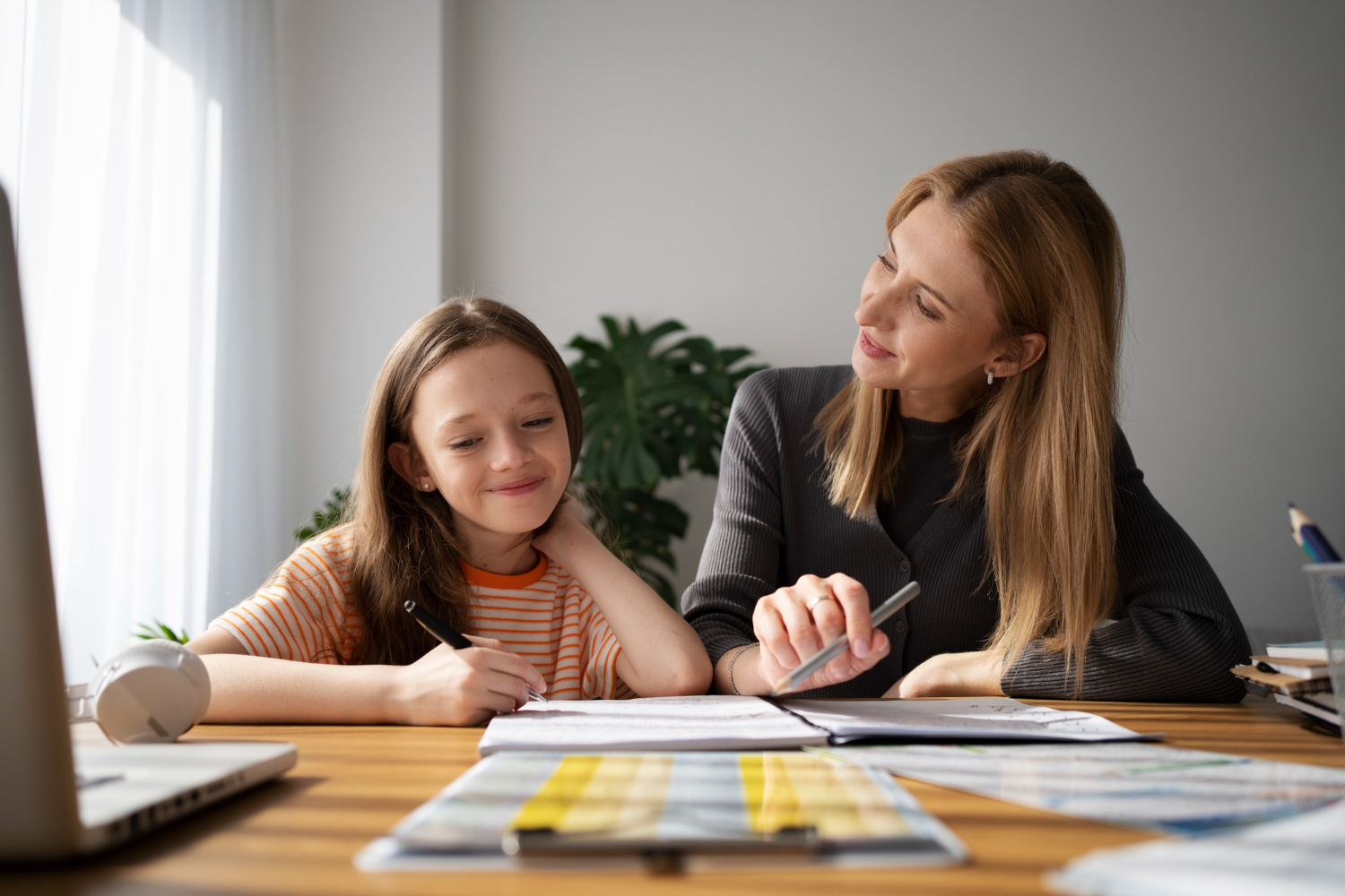A dedicated private English tutor in Dubai clarifies complex grammar concepts for a student during a focused, in-person session.