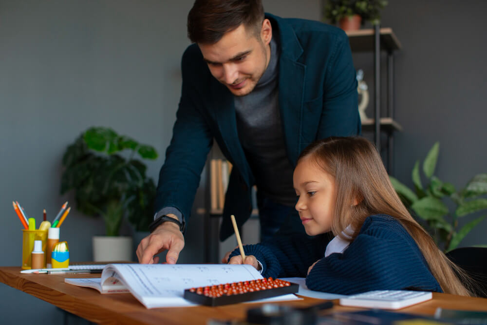 Professional home tutor providing personalized one-on-one tutoring to student in comfortable Dubai home environment
