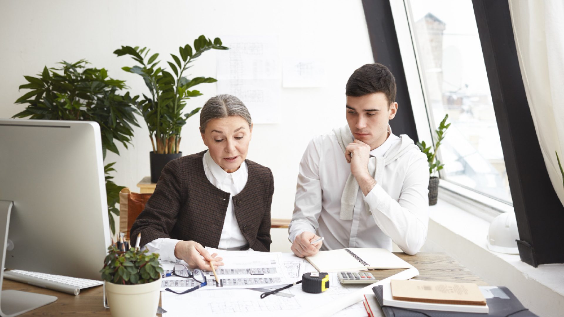 A private Business Studies tutor provides personalized exam preparation help to a student in a comfortable, distraction-free home setting in Dubai.