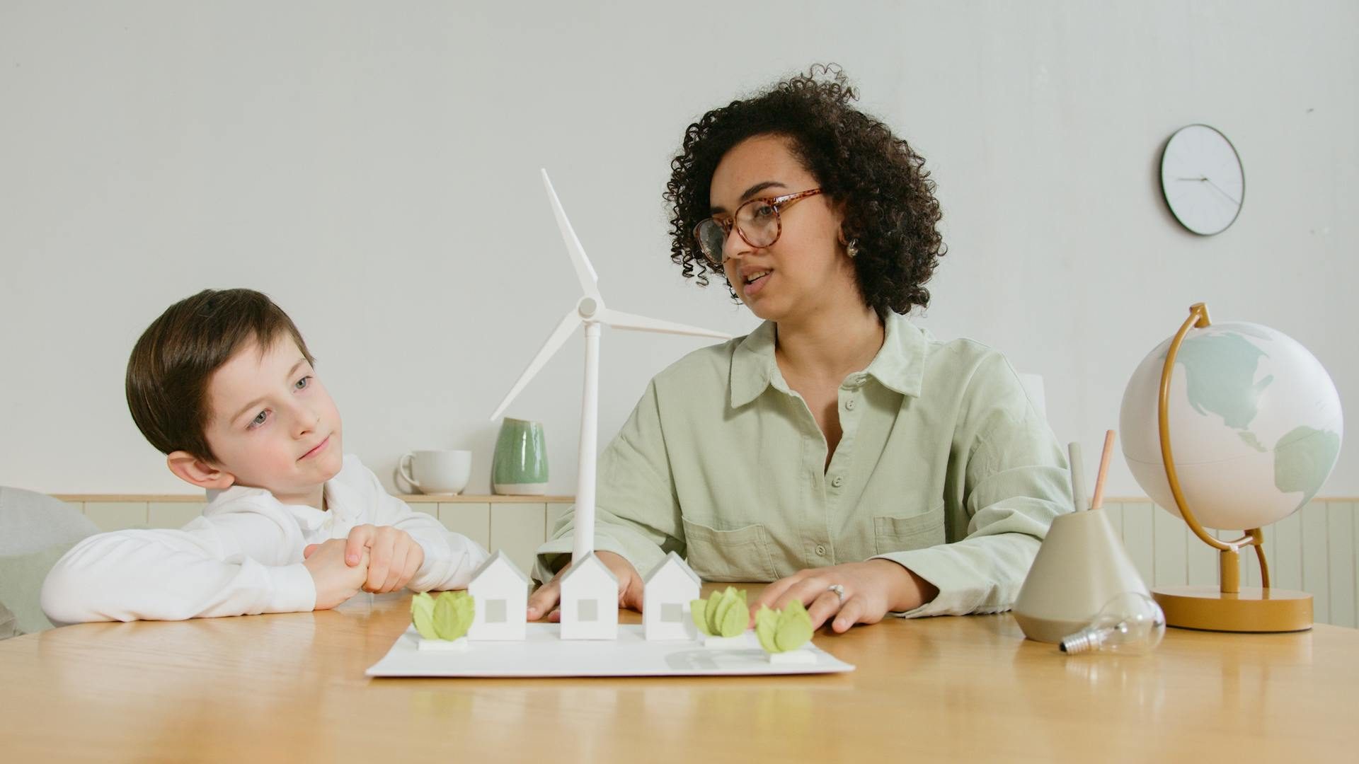 home tutor teaching science to elementary student